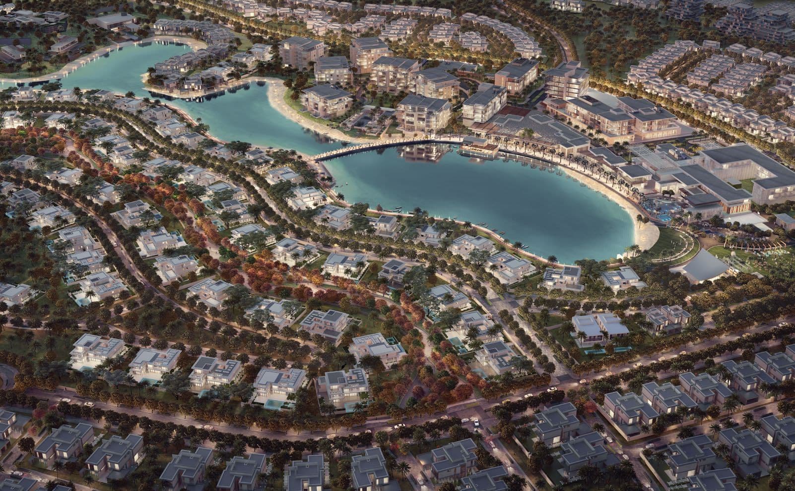 Aerial dusk rendering of a villa compound around a turquoise lagoon, the Dubai project awarded to Perfect Engineering for 3D modelling.